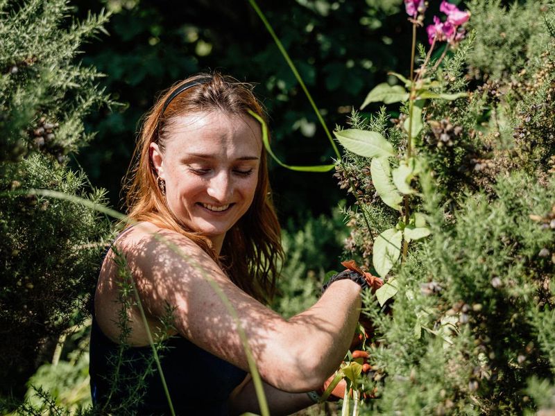 Conservation volunteer working with native plants at Waterside Farm